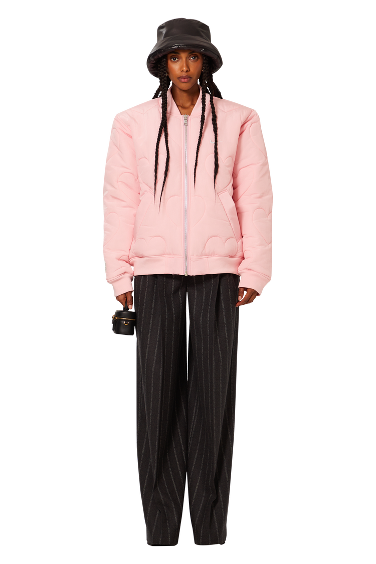 Model wearing Nike x NOCTA Certified Lover Boy Bomber Jacket (Friends & Family) 'Pink'