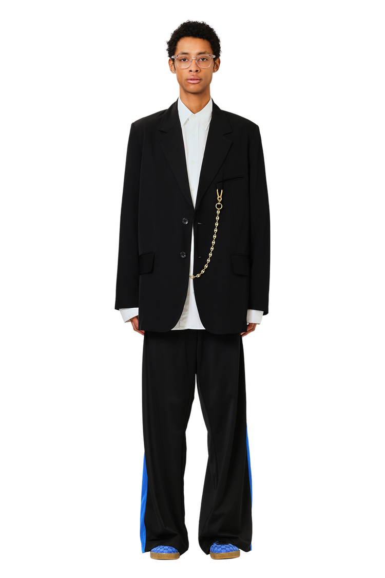 Model wearing Gucci x Gazelle 'Blue GG Monogram'