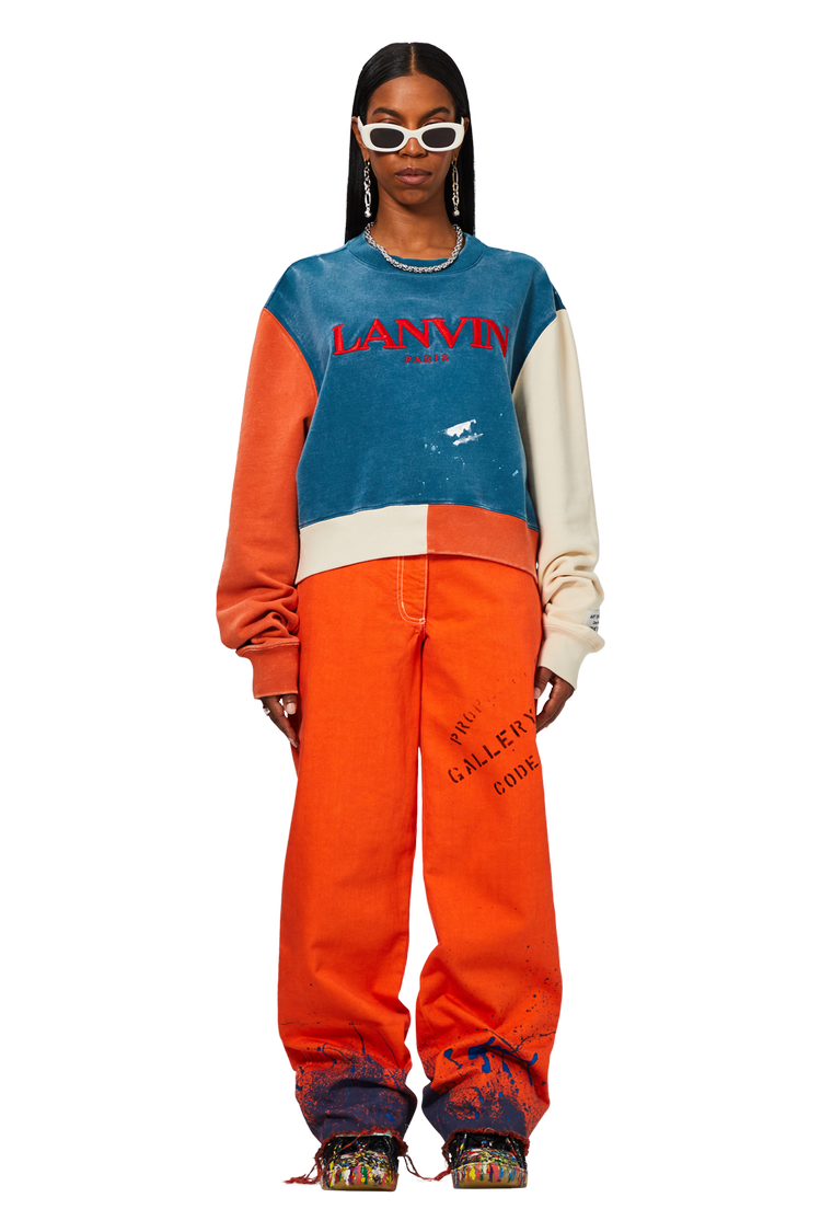 Model wearing Gallery Dept. x Lanvin Paint Splatter Jeans 'Orange'
