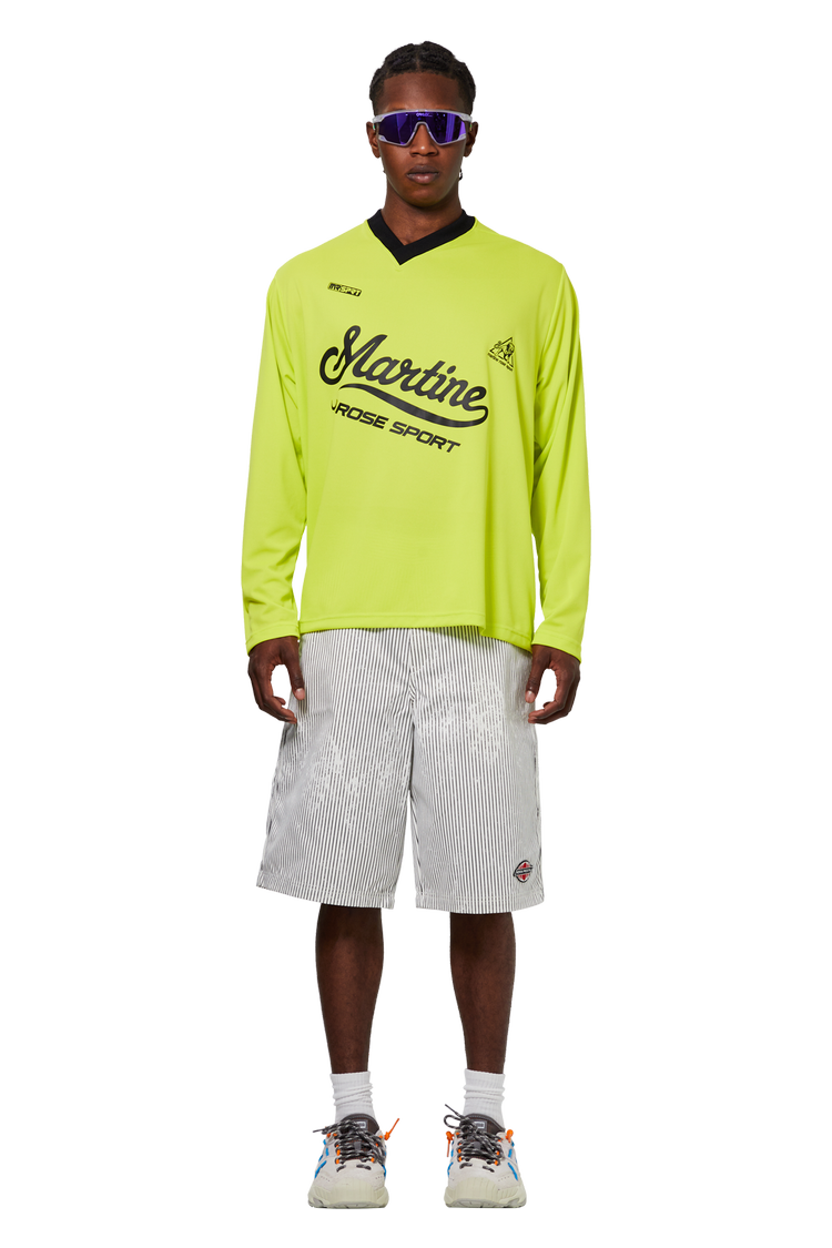 model wearing Martine Rose Long-Sleeve Twist Football Top 'Fluorescent Yellow'