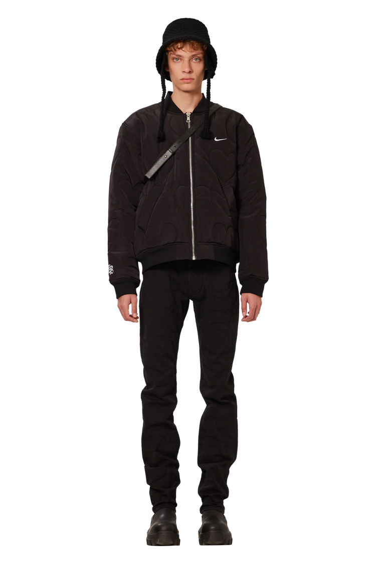 model wearing Nike x NOCTA Certified Lover Boy Bomber Jacket (Friends & Family) 'Black'