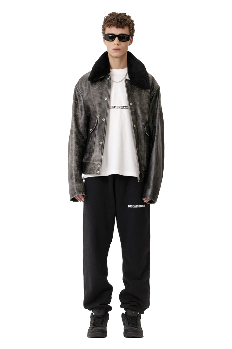 Model wearing GOAT Exclusive Paris Saint-Germain ‘92-’96 Letter Crest Logo Sweatpants 'True Black'