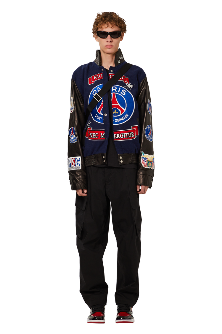 model wearing Paris Saint-Germain x Jeff Hamilton Limited Edition Jacket For The Champion 10th Title 'Blue/Black'
