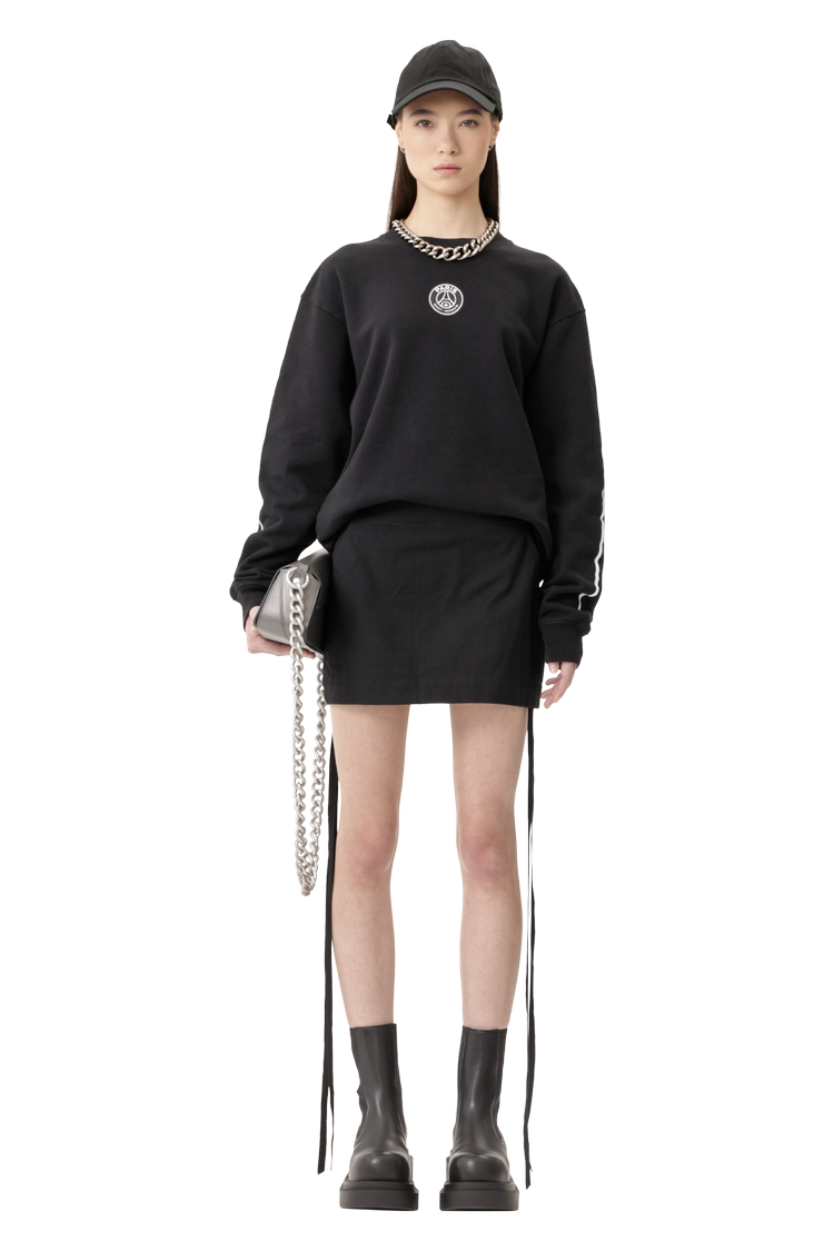 Model wearing Ann Demeulemeester Magdalena Slouchy Waist Mini Skirt 'Black'