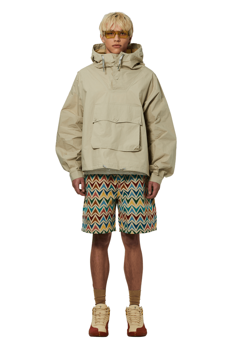 Model wearing Pleasures Basket Woven Shorts 'Multicolor/Khaki'