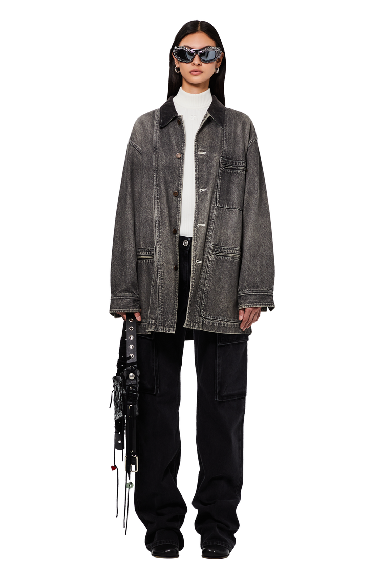 model wearing GOAT Exclusive for Manifesto Ottolinger Twisted Sunglasses 'Metallic Stone'