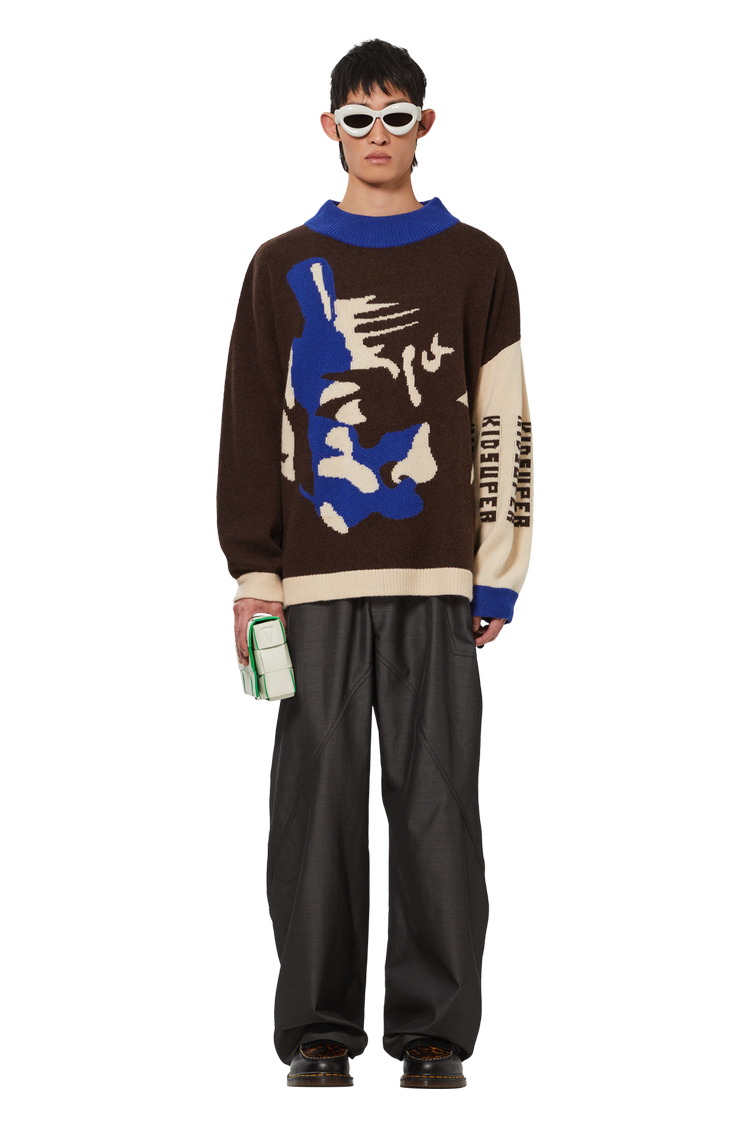 model wearing KidSuper Faces Sweater 'Black'