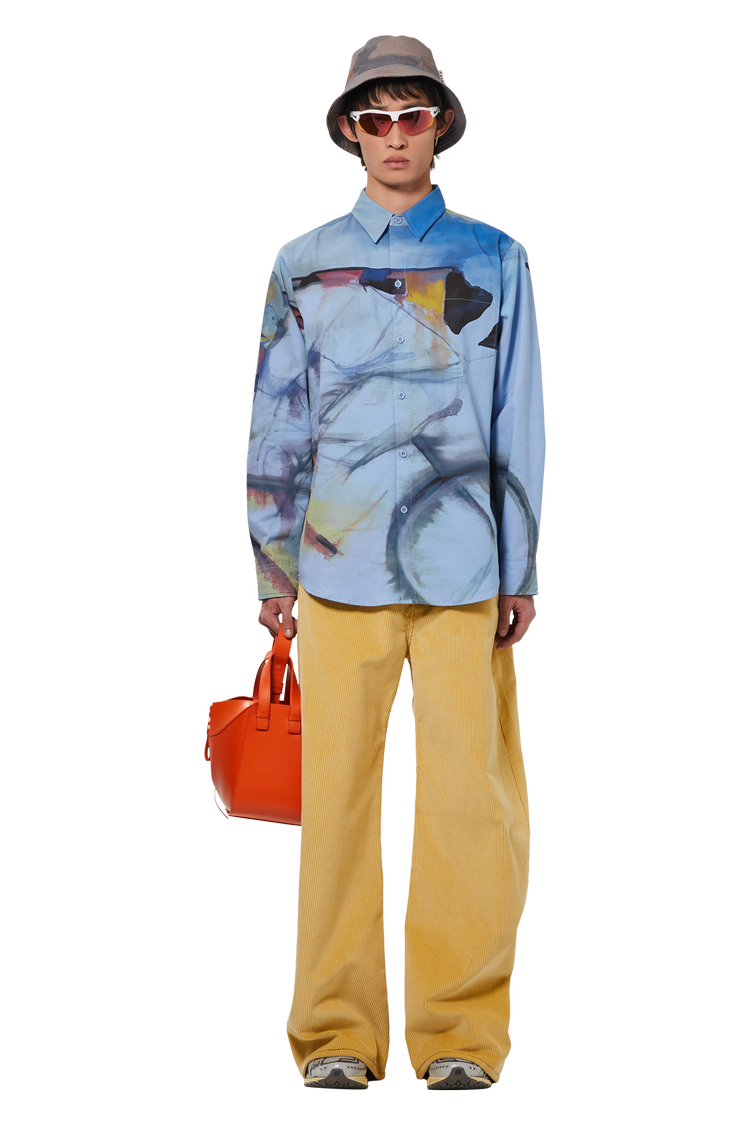 model wearing KidSuper Long-Sleeve Shirt 'Blue'
